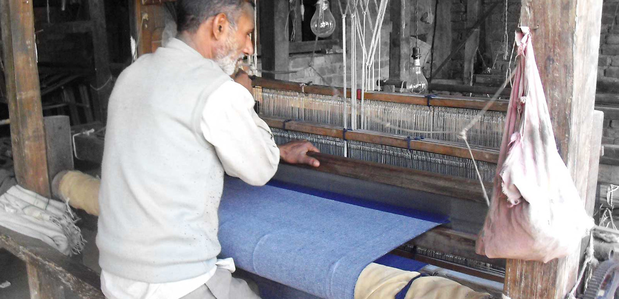 Artisan Weaving Selvedge Denim on Manually Operated Wooden Frame Handloom